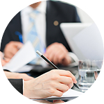 People in a meeting signing papers