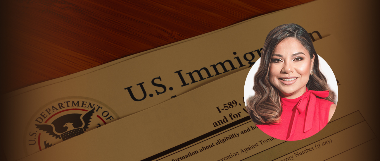 Attorney Janeth Moreno in front of a U.S. Immigration Document